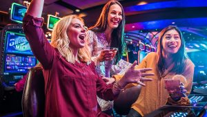 Three-Girls-Having-Fun-Playing-at-a-Casino