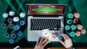 Poker on a laptop with poker chips