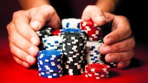 Hands pushing poker chips