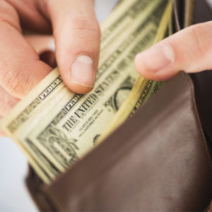 hand with money in wallet