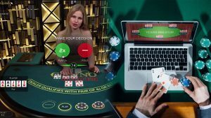 Live Dealer Poker Game on the Left and Someone Playing Poker on a Laptop on the Right