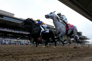 Riders compete in the Breeders' Cup Dirt Mile horse race