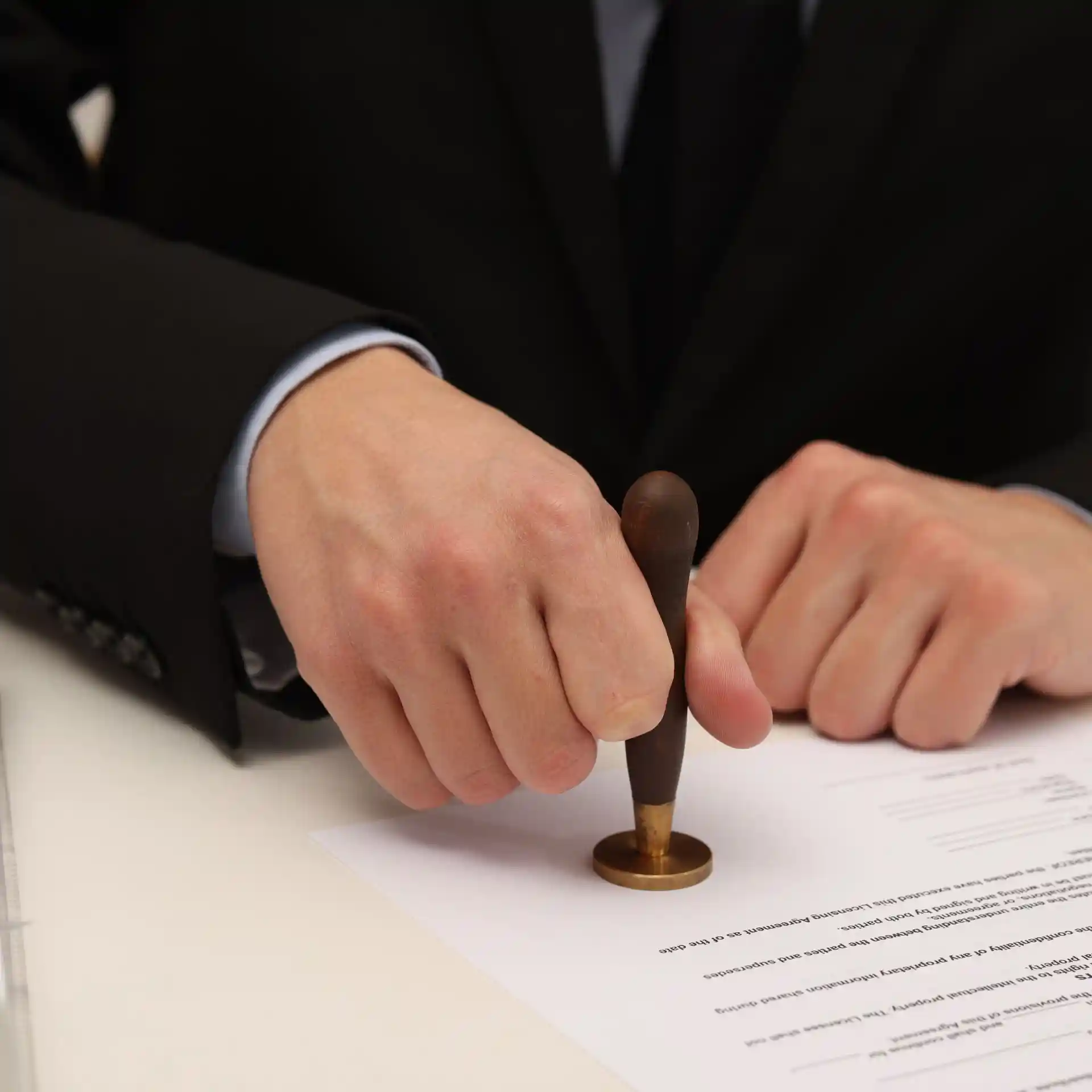 a man stamping a document