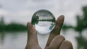 hand holding transparent orb