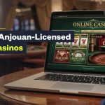 Laptop displaying an online casino website with slot games and a live dealer roulette table, alongside “The Top Anjouan-Licensed Online Casinos” text overlay.