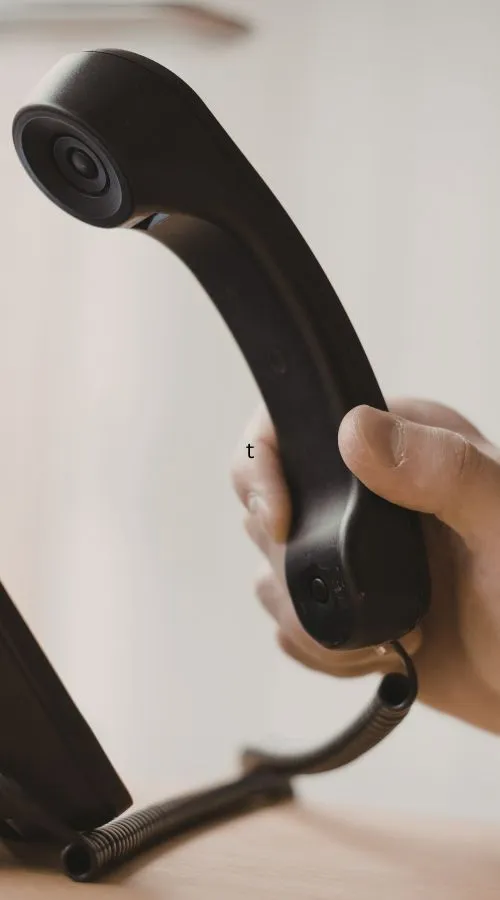 hand picking up a phone