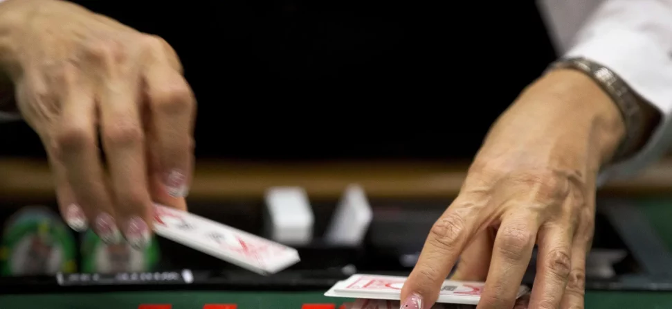 Dealer shuffling cards