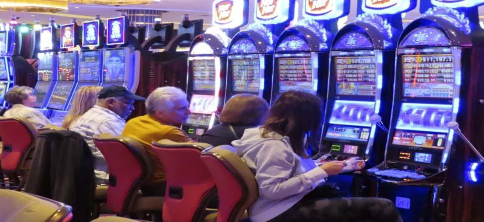 People playing slot machines