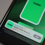 Phone with Kalshi app opened