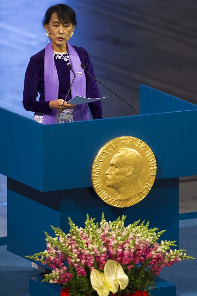 Aung San Suu Kyi, holds her speech during the Peace Nobel Prize lecture at the city hall in Oslo, Saturday, June 16, 2012. Burmese opposition leader Aung San Suu Kyi Nobel peace prize laureate, formally accepts the prize that thrust her into the global limelight two decades ago. Suu Kyi says the Nobel Peace Prize she won while under house arrest 21-years ago helped to shatter her sense of isolation and ensured that the world would demand democracy in her military-controlled homeland. (AP Photo/Markus Schreiber)