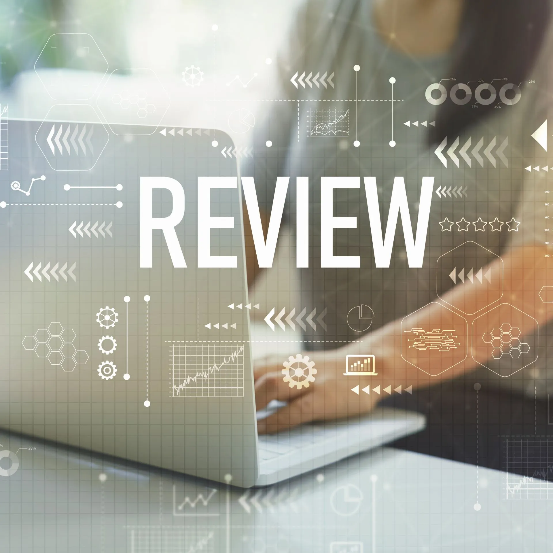 A person typing on a laptop with transparent digital icons and graphs overlaid, featuring the word “REVIEW” in large white letters across the image
