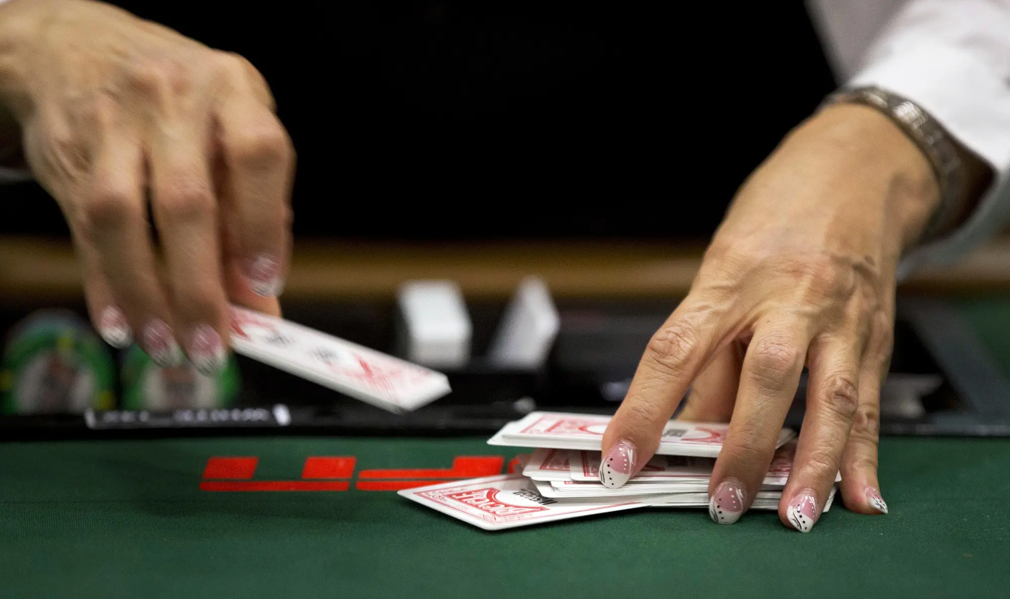 Dealer shuffling cards
