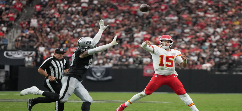Patrick Mahomes throwing a pass against the Las Vegas Raiders